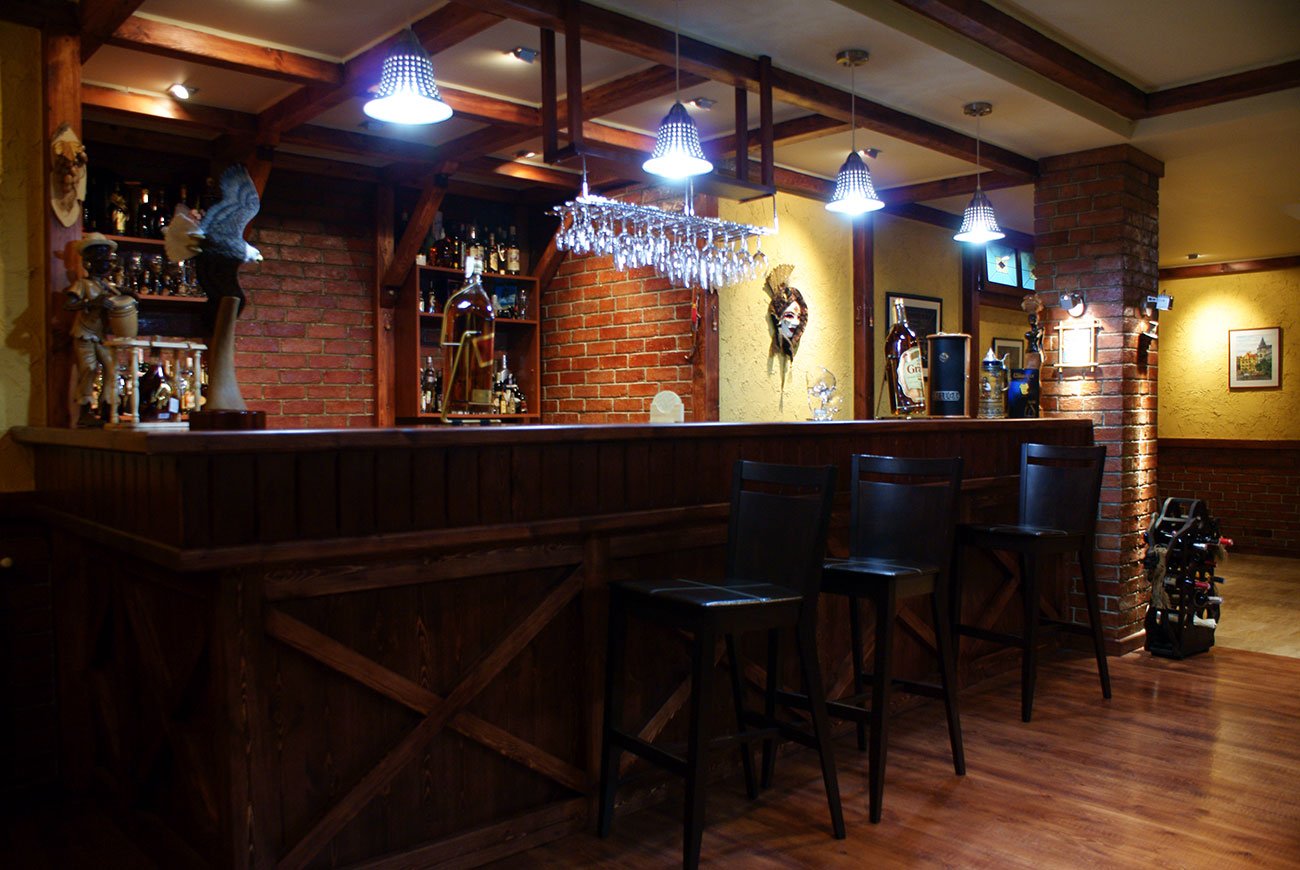 photo of the INTERIOR of a PRIVATE HOUSE, where the bar counter and chairs are made to order