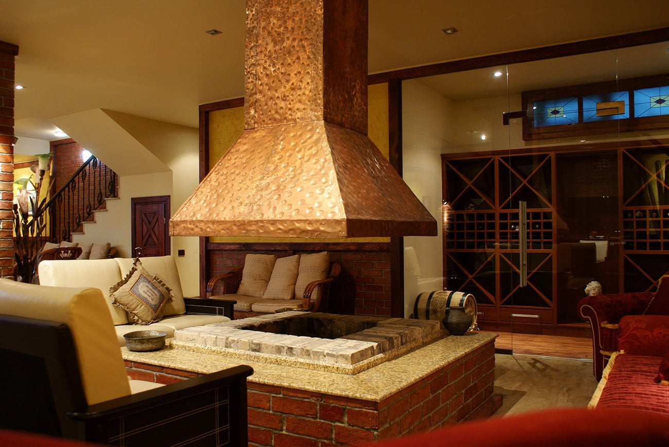 photo of a fireplace and a fireplace zone in the INTERIOR OF A PRIVATE HOUSE for gathering large companies