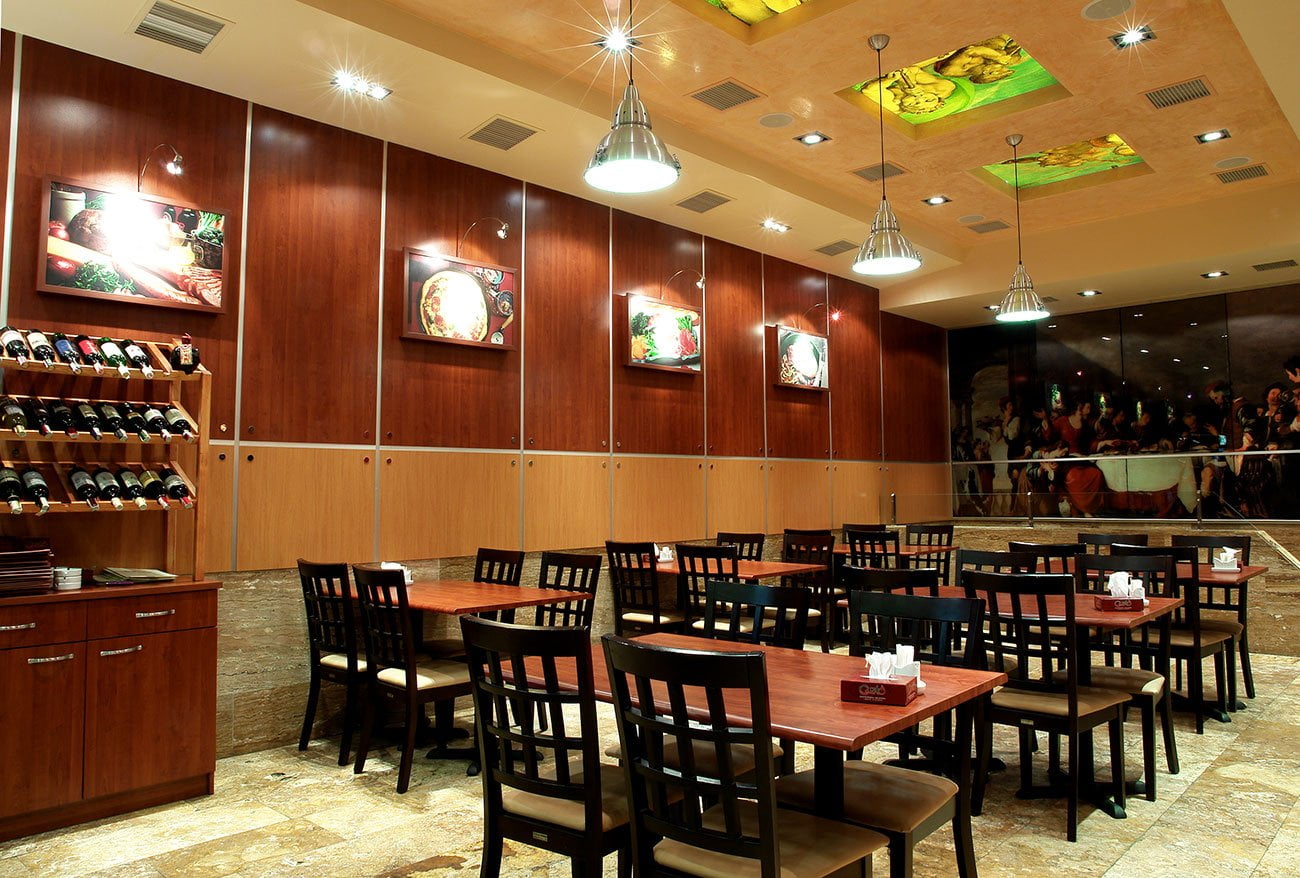 photo of the main hall of the GUSTO restaurant using wooden panels on the walls