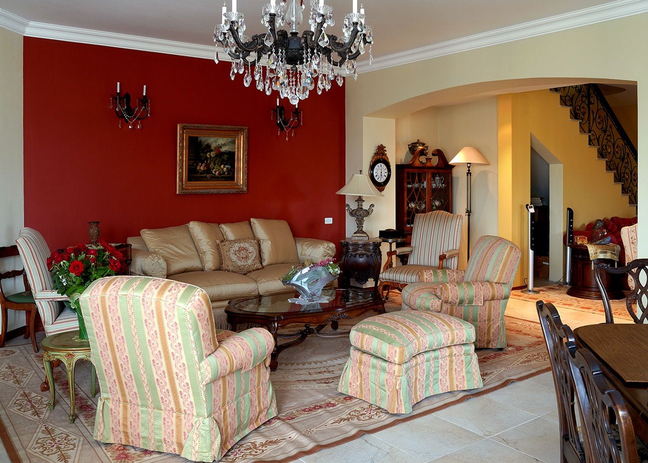 photo of the living room area highlighted and outlined with an antique carpet with furniture and bedside tables