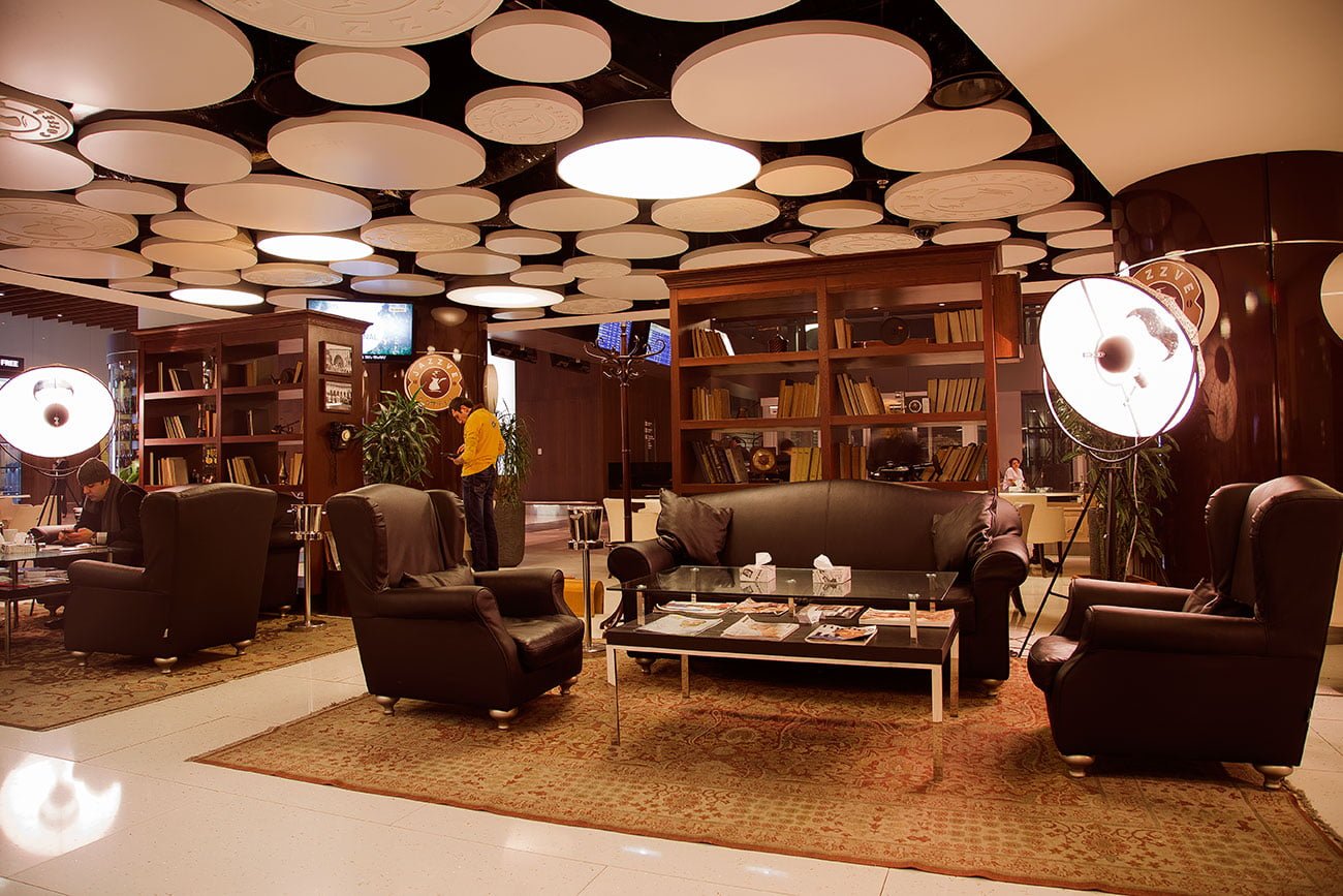 photo of the interior with carpets, shelving and round lamps in Jazzve in Zvartnots