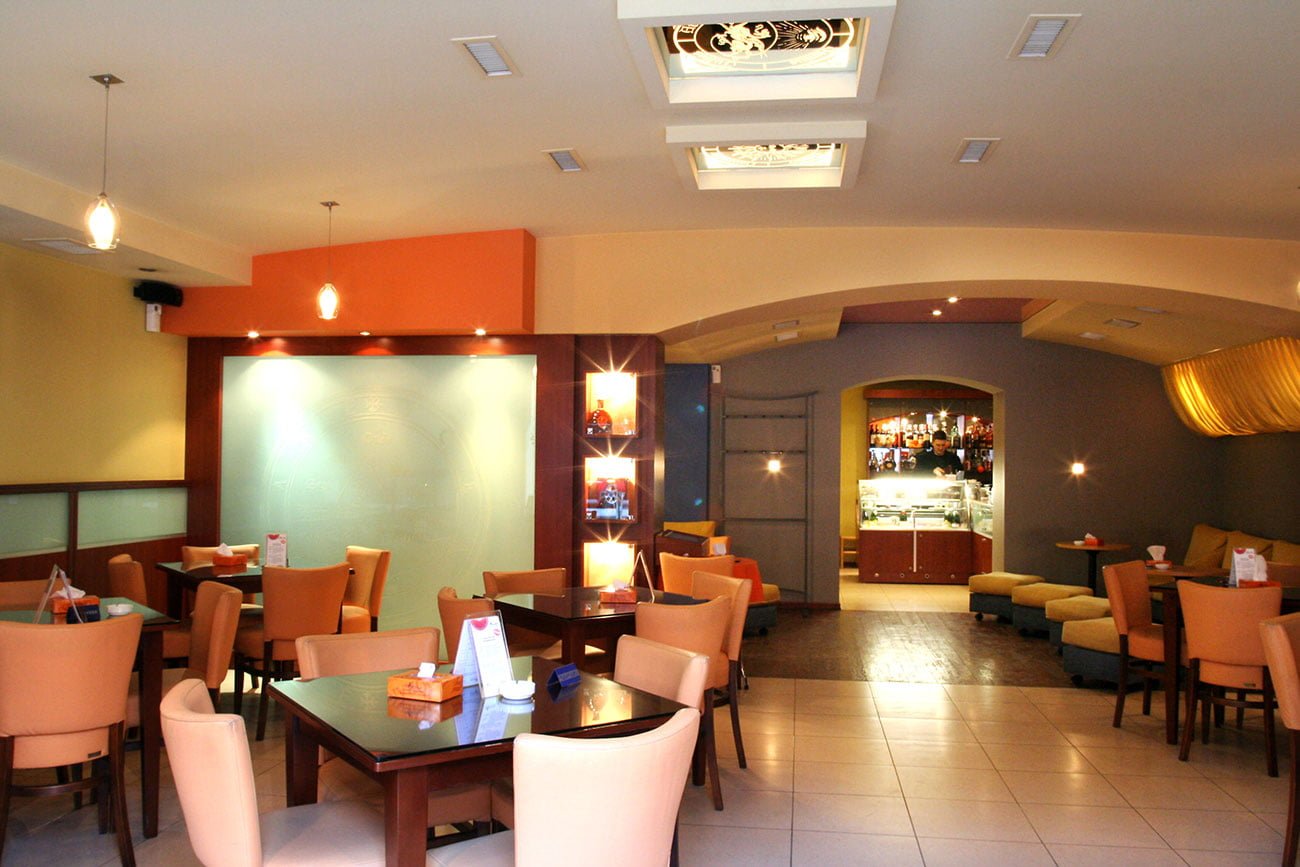 photo of the common hall LORANGE cafe and lounge areas with luxury elements and stained glass windows