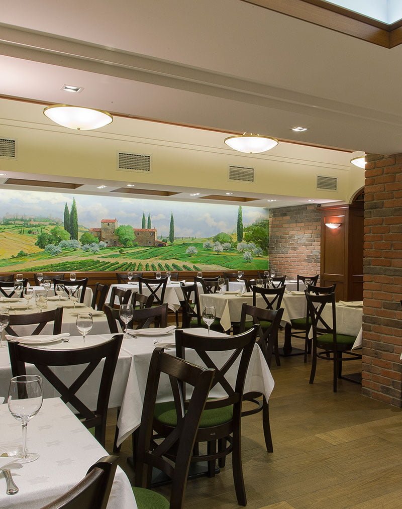 photograph of a view of the hall with a fresco in the Italian restaurant Oliva, Yerevan, Armenia