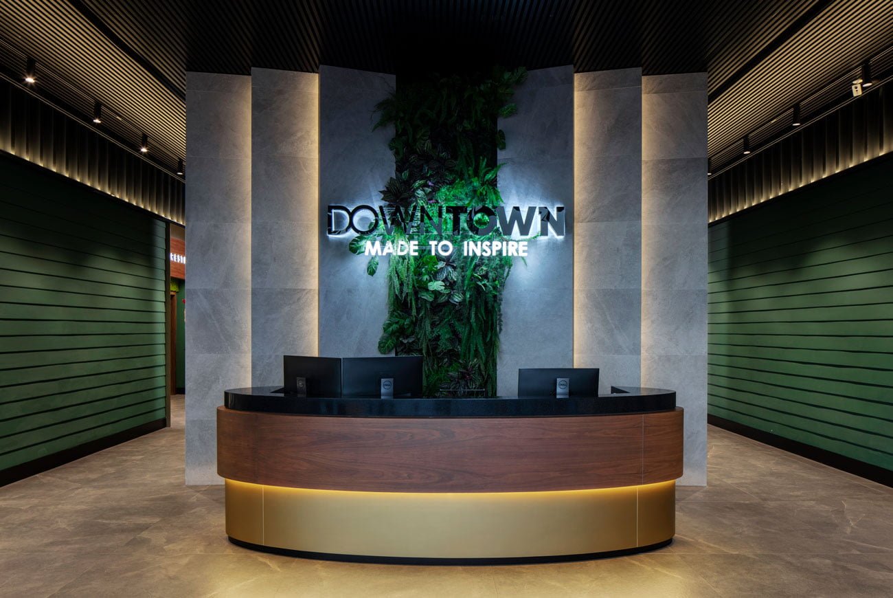 photo of the view at the entrance to the downtown multifunctional center with a reception desk and a logo