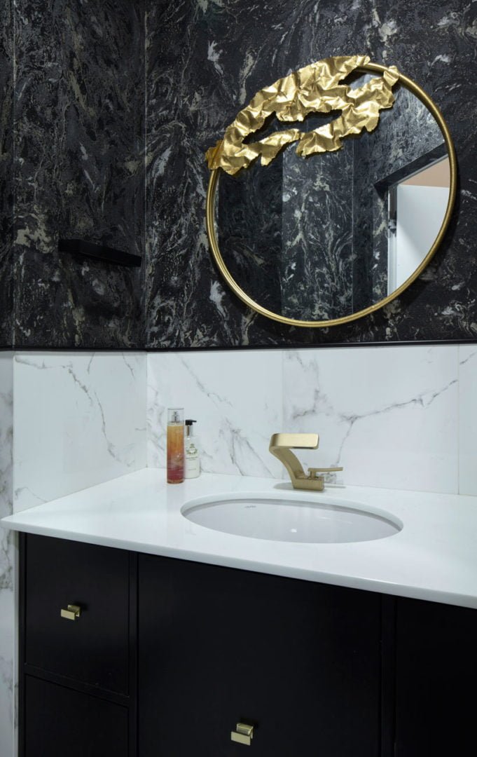 photo of a white and black marble dressing room with art deco elements