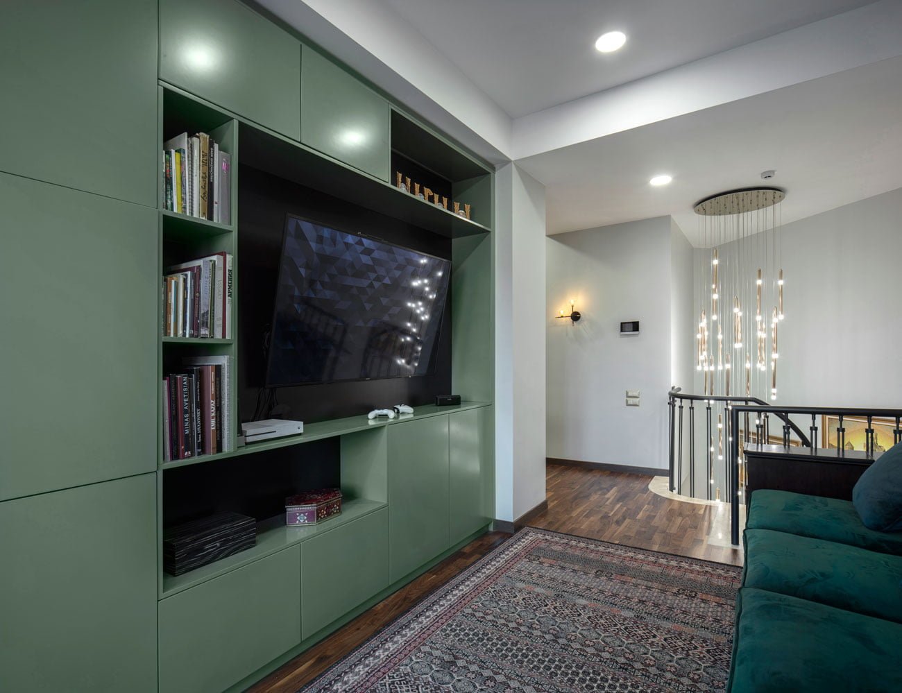 photo of the lobby area for privacy with a TV, bookcase and a large sofa