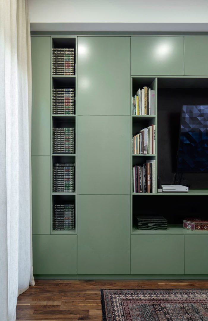 photo of a bookcase in a modern style with an original arrangement of shelves